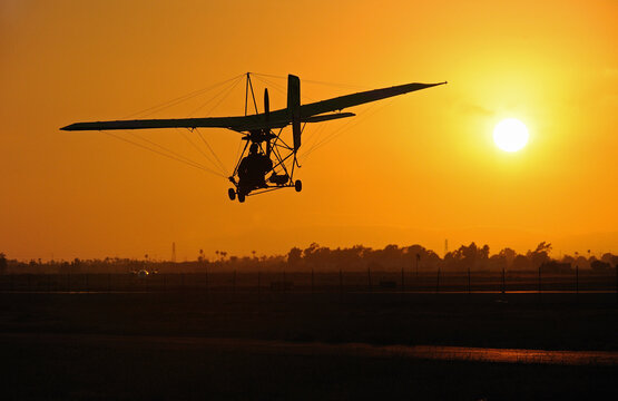 Single seat ultra light coming in for landing at sunset, Camarillo Airport, Camarillo, CA, USA