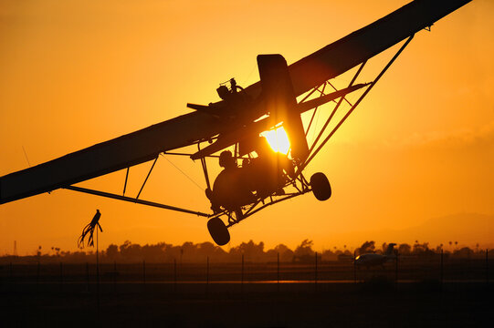 Dual seat ultrlight coming in for landing at sunset, Camarillo Airport, Camarillo, CA, USA