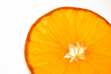 luminous mandarin slice on white background