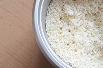 Close up view of cooked rice in electric rice cooker.