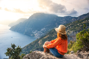 Young girl on Positano coast background, Amalfi, Italy