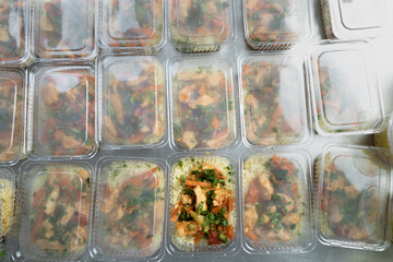 food delivery in the restaurant. Business lunch in an eco-friendly plastic container, ready for delivery. View from above. Office Lunch boxes with rice meals. Food is taken away. Meals,