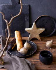 still life with eclairs on a dark background