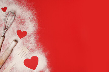 Valentine's Day Baking background. Hearts of flour with rolling pin on red table, copy space