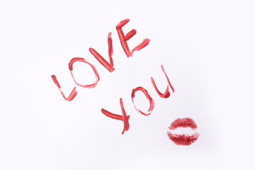 Red color lipstick paint text i love you isolated on white background