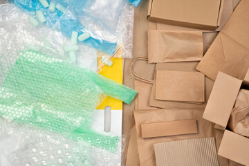 Plastic bags vs brown paper packaging, top view