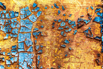 Wood texture background with pieces of old peeling cracked blue paint. Naturally old wood plank, shabby surface.