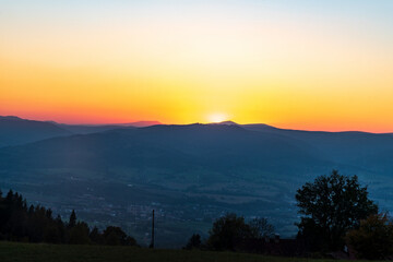 Moravskoslezske Beskydy mountains with highest Lysa hora hill from Bahenec in Slezske Beskydy mountains in Czech republic during sunset
