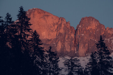 The snow-capped Dolomites illuminated by the setting sun