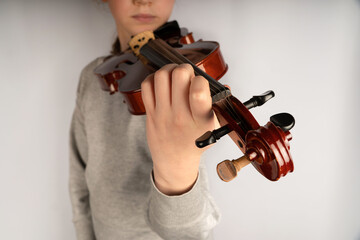 child plays the violin. violin close-up
