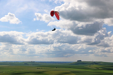 Paraglider flying in the Pewsey Vale, Wiltshire