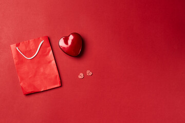 Valentines day gift on red background. Heart shape gift box with surprise. Love day concept....