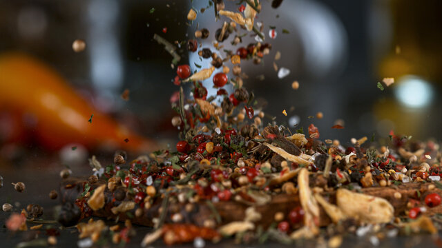 Freeze Motion Shot of Falling Mix Spices. Isolated on Black Background.