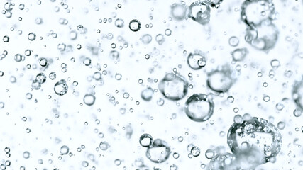 Moving Bubbles on White Background, macro shot.