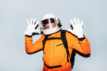 Man with astronaut helmet dazzled by intense light.