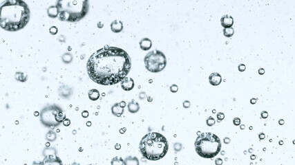 Moving Bubbles on White Background, macro shot.