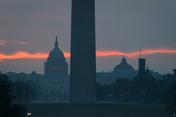 Washington DC monuments including the Capitol and Washington Monument as seen between columns of...