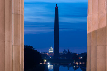Washington DC monuments including the Capitol and Washington Monument as seen between columns of...