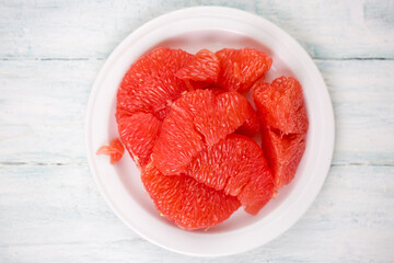 Juicy delicious ripe grapefruit on a white plate