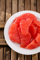 Juicy delicious ripe grapefruit on a rustic background