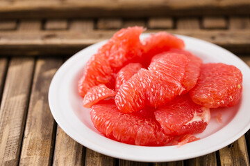 Juicy ripe grapefruit on a rustic background