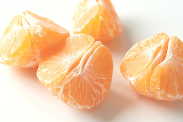 unpeeled slices of yellow mandarin