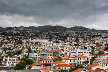Fototapeta na wymiar View of the city of Funchal, Madeira Mountains and houses on the background.