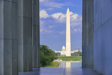 Washington DC monuments including the Capitol and Washington Monument as seen between columns of...