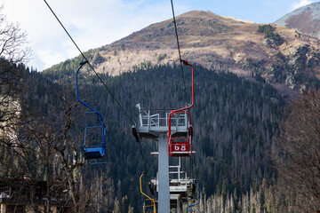 Multi-colored lifts in the mountains. Active lifestyle and sports.