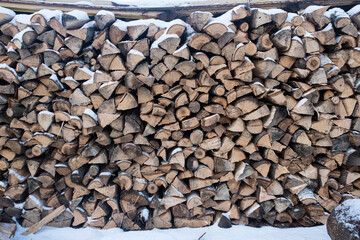 Stacks of Firewood. Preparation of firewood for the winter. Pile of Firewood.Firewood background