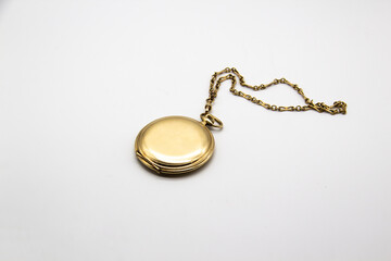 Vintage golden old pocket watch on white background.