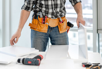 Man working during process of furniture manufacturing