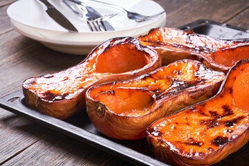 Homemade roast butternut squash  in baking sheet.