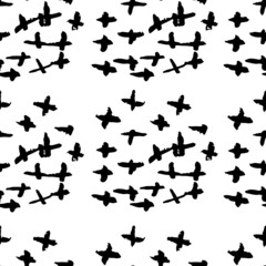 Vector seamless pattern with black crosses on white background. Ink brush strokes. Hand drawn grunge texture.