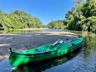 Pack canoe on calm river Tavignano with beautiful green nature. Corsica, France. - Powered by Adobe