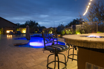 Fototapeta premium A night time view of a desert landscaped backyard in the American southwest.