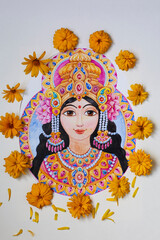 Beautiful goddess Lakshmi with flowers and ornaments painted in watercolors and surrounded by fresh yellow flowers.