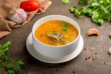 pea soup in a bowl with meat on browm table