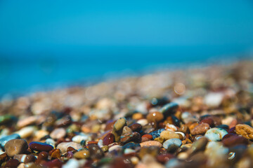 Pebbles on the beach by the sea. Selective focus.