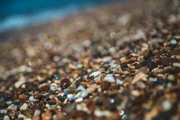 Pebbles on the beach by the sea. Selective focus.