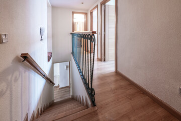 Duplex housing distributor with metal railing and down stairs to another floor
