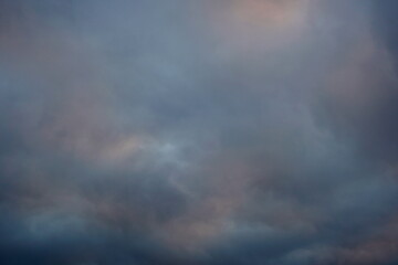 Fototapeta premium Tinted pastel cool colors background of cloudy sky at twilight in winter