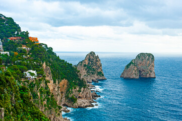 Coastline of the Island of Capri -apri's most iconic sight is the dramatic Faraglioni, three towering rock formations
