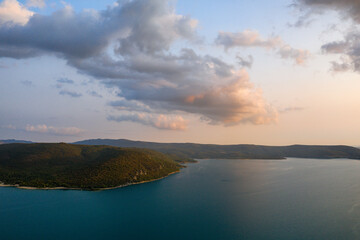 The Lake of Sainte-Croix and the clouds of the sunset in Europe, in France, Provence Alpes Cote dAzur, in the Var, in summer.