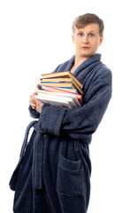 portrait of a man in a gray terry bathrobe. man holds many books and smiles, read a book, relax on a day off, on vacation, after work, quarantine. better at home, stay home. isolated.