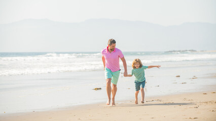 Naklejka premium daddy with kid boy on summer day. dad and child having fun outdoors. childhood