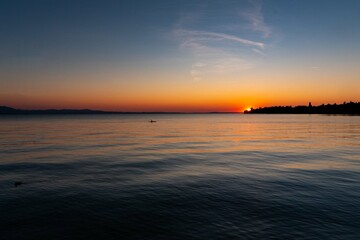 sunset lake water headland sky