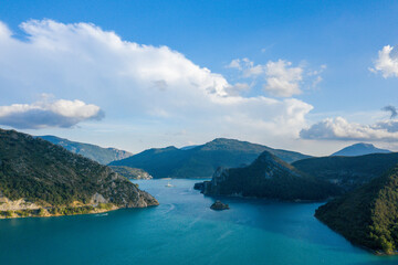 Obraz premium The Lac de Castillon and its green vegetation in Europe, in France, Provence Alpes Cote dAzur, in the Var, in summer, on a sunny day.