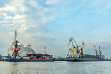 seaport with cranes and cargo ships