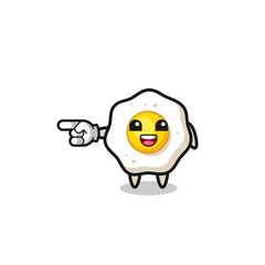 fried egg cartoon with pointing left gesture